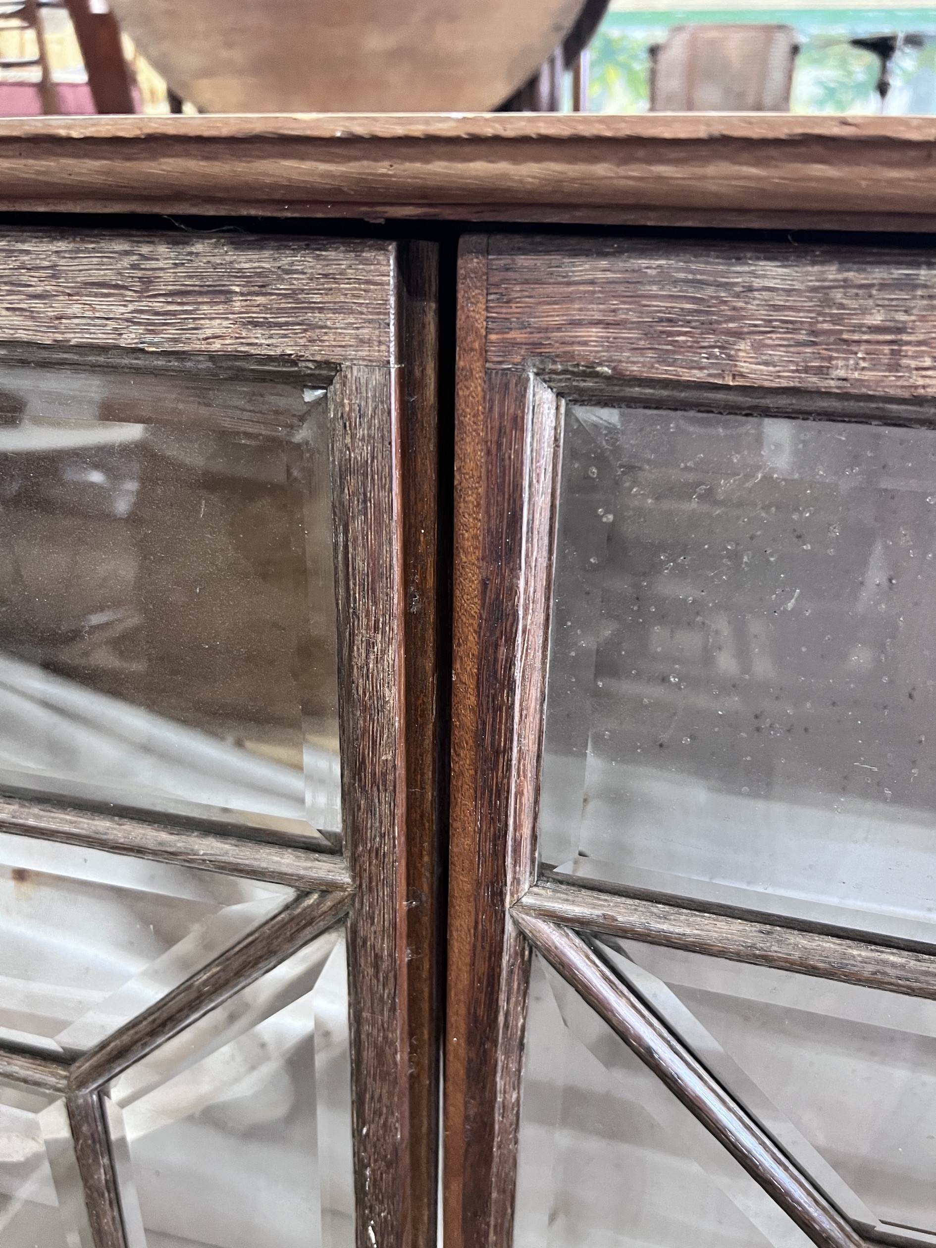 A George III style oak bookcase section, length 130cm, depth 27cm, height 110cm